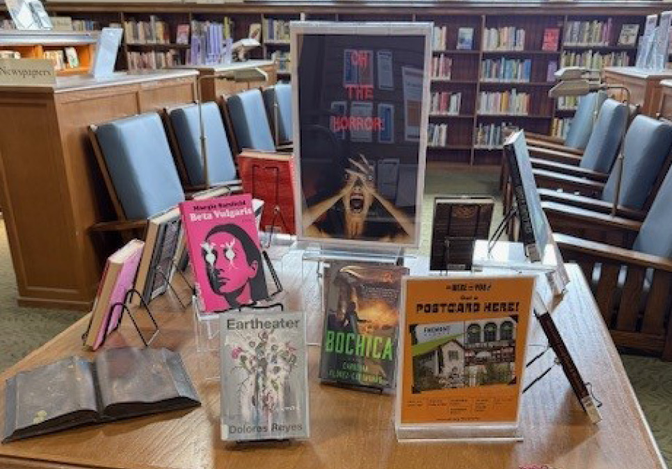 A display of horror-themed books and other media.