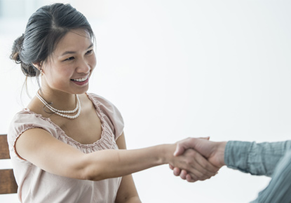 women giving handshake