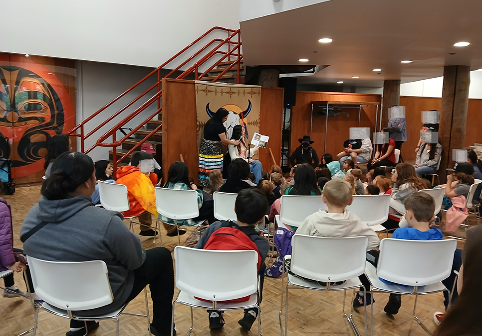 Individuals gathered in a half-circle at a youth book group 